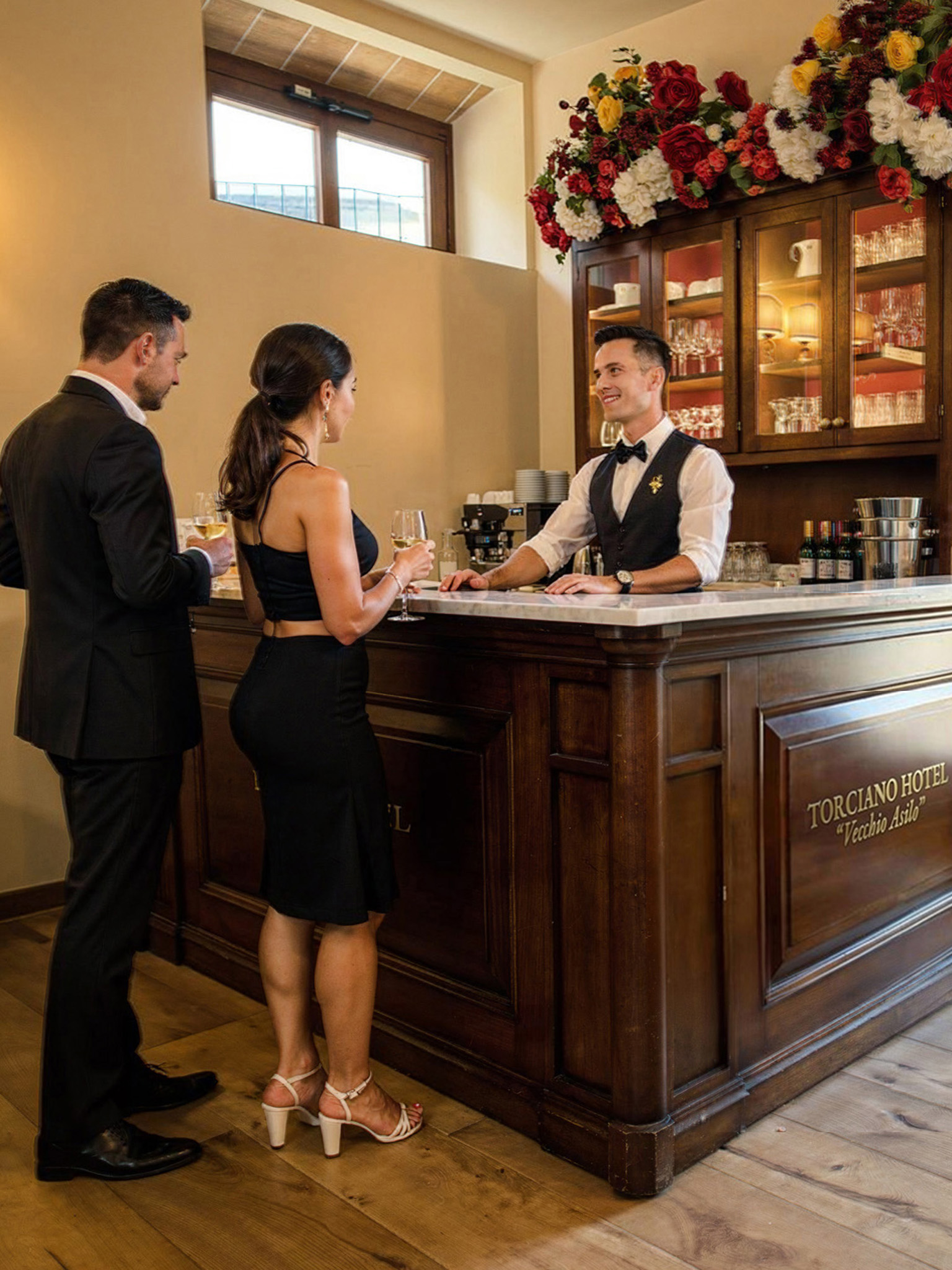 Degustazione di vino al bar di Hotel Torciano Vecchio Asilo, ospiti serviti dal barman