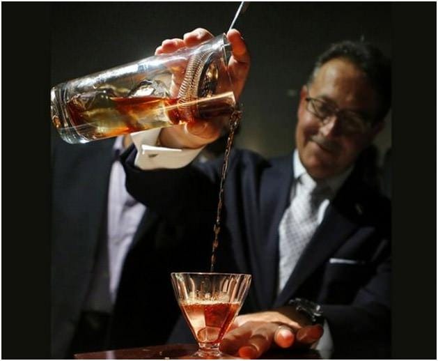 Barman at work behind the bar